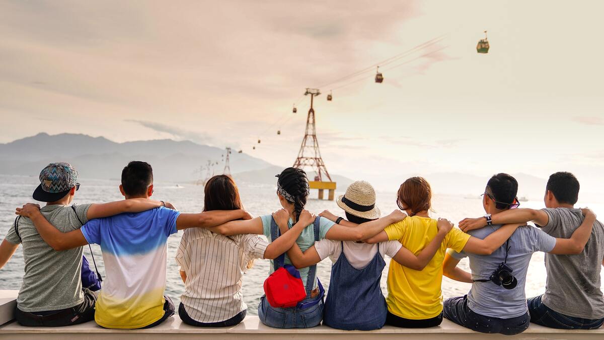 A group of people in front of the sea